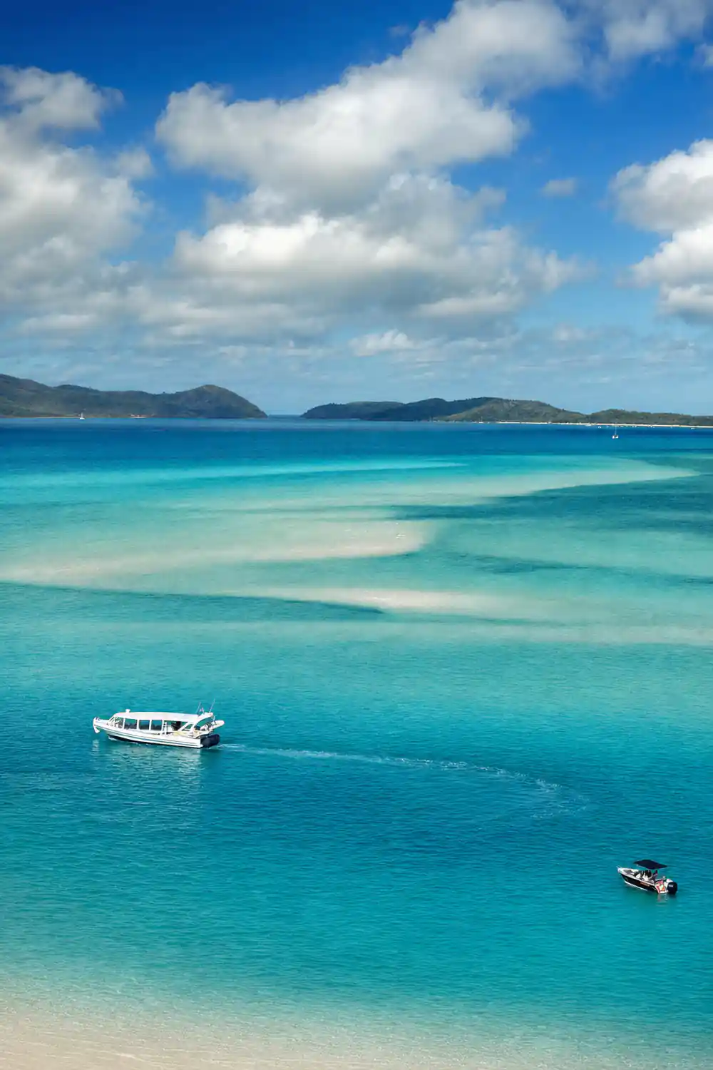Turquoise bay with boat viewed from above