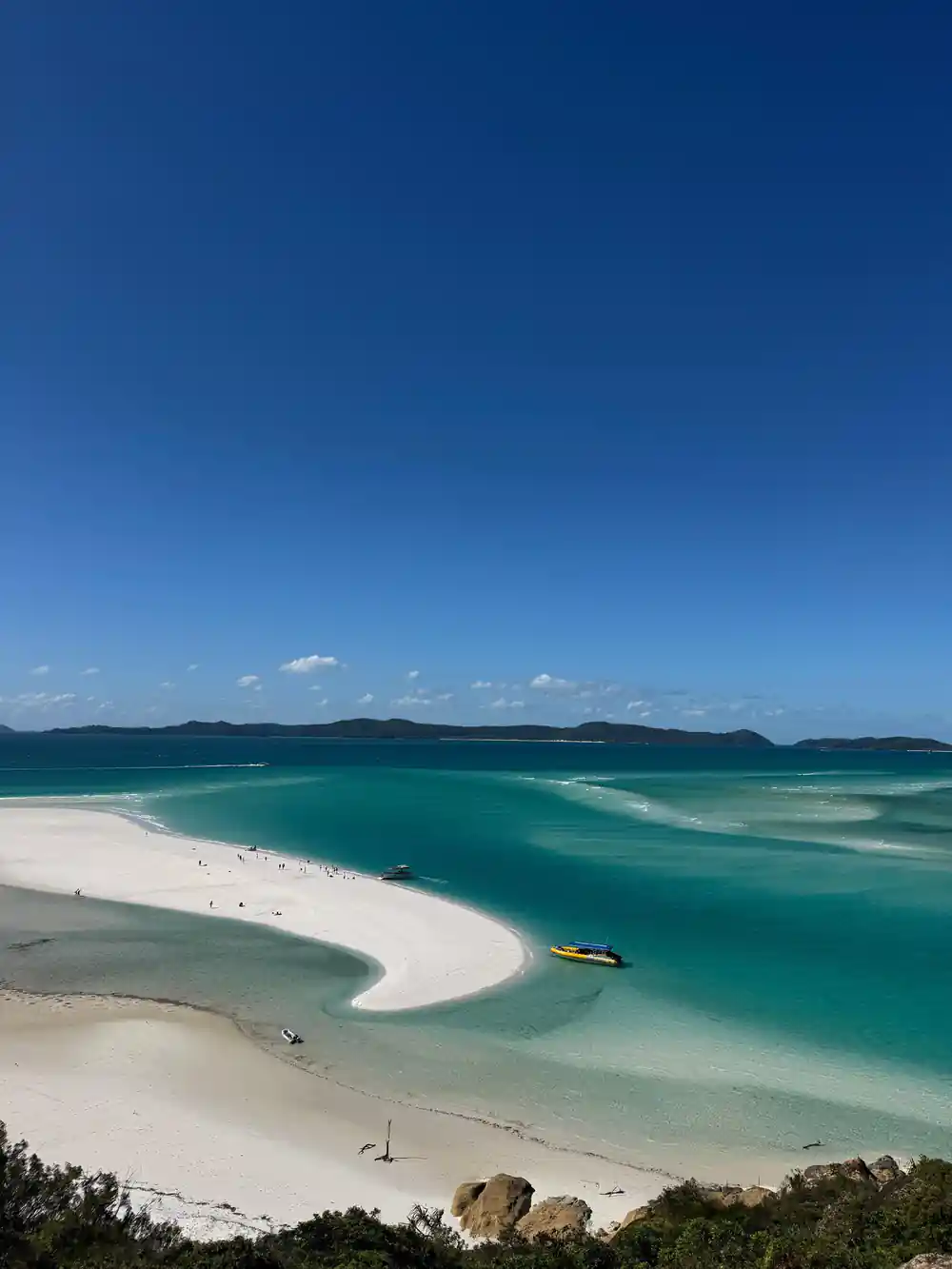 White sand bar curving in turquoise shallow water